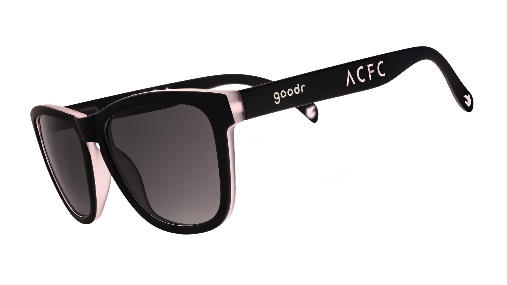 Three-quarter angle view of black and pink sunglasses with black gradient lenses and ACFC logo.
