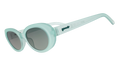 Three-quarter angle view of translucent pale green oval Beat G sunglasses with green gradient lenses.