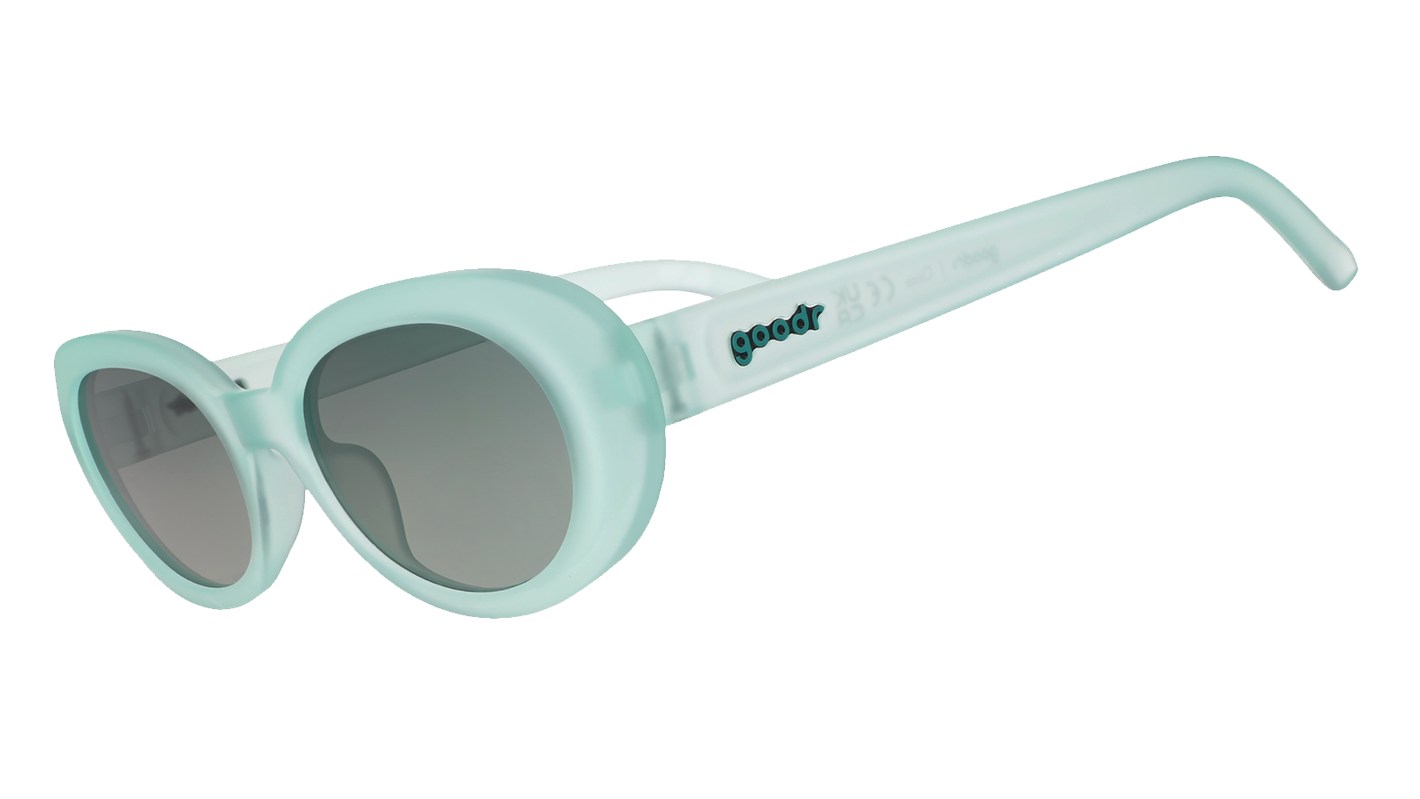 Three-quarter angle view of translucent pale green oval Beat G sunglasses with green gradient lenses.