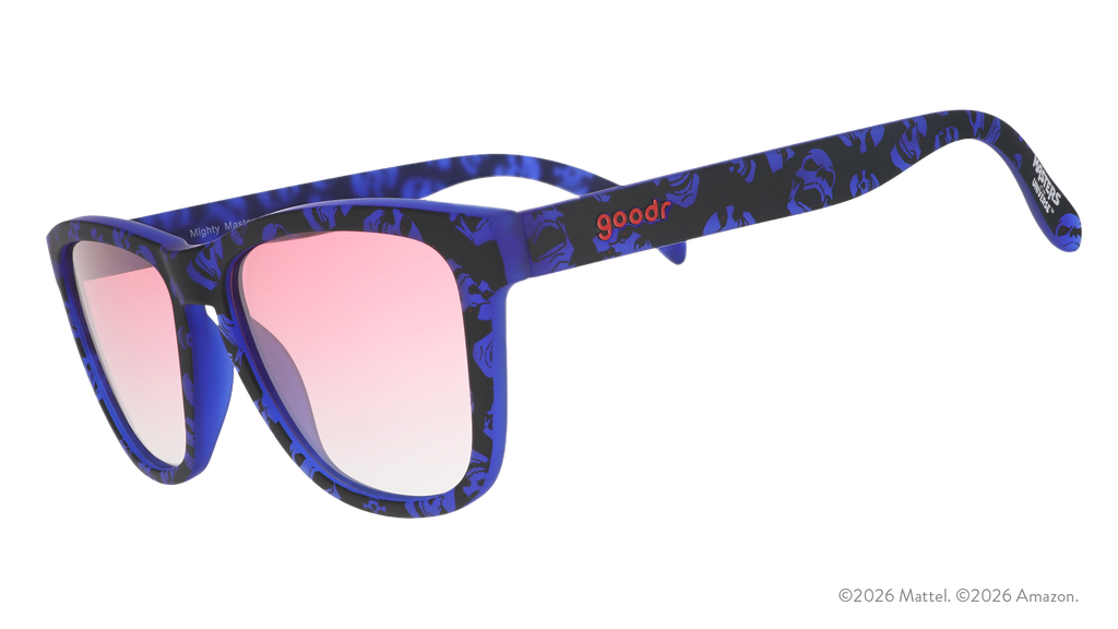 Three-quarter angle view of blue and black sunglasses featuring a Skeletor pattern and rose gradient lenses.