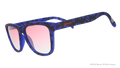 Three-quarter angle view of blue and black sunglasses featuring a Skeletor pattern and rose gradient lenses.