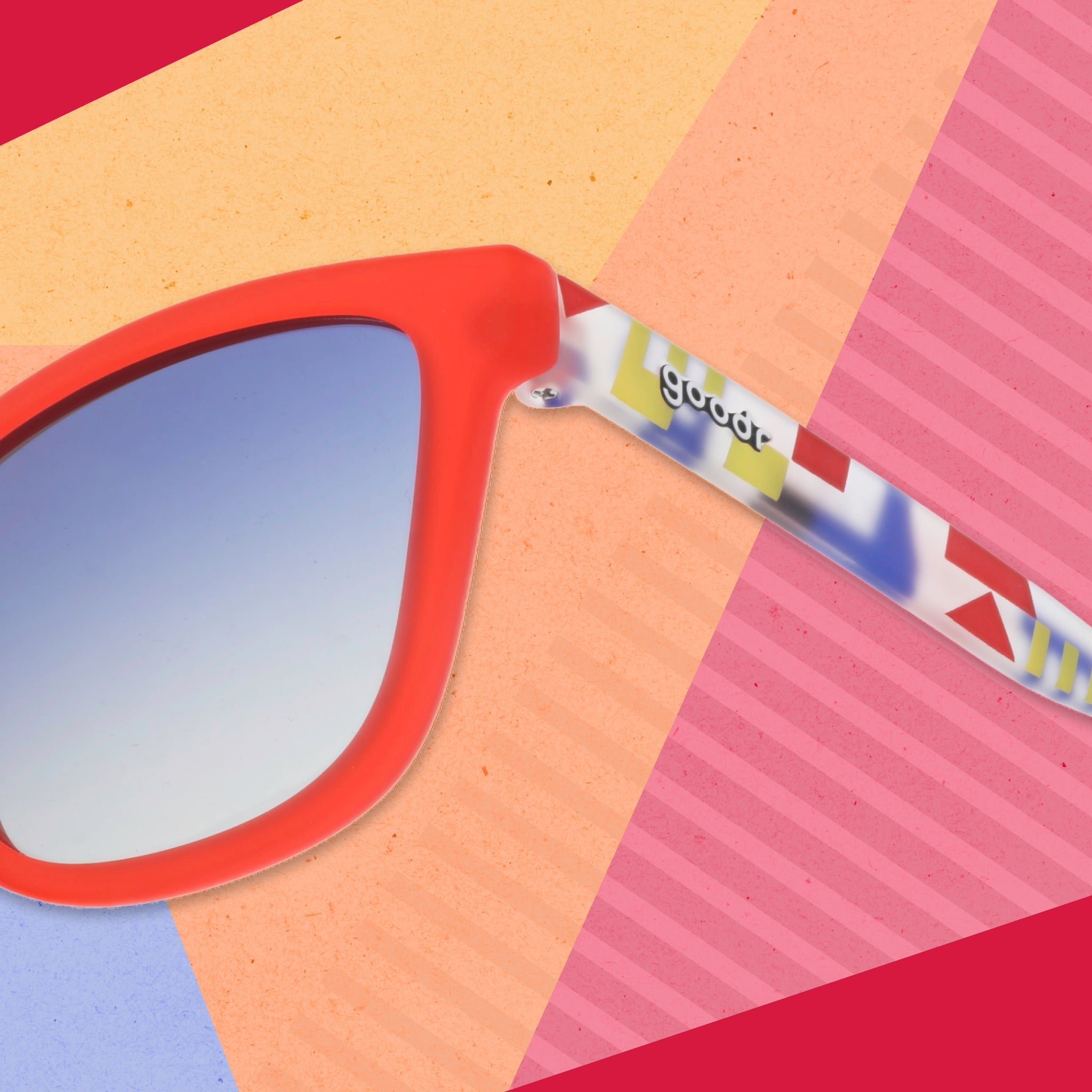 Close-up view of the temple on a pair of red sunglasses with multi-colored arms depicting maritime signal flags.