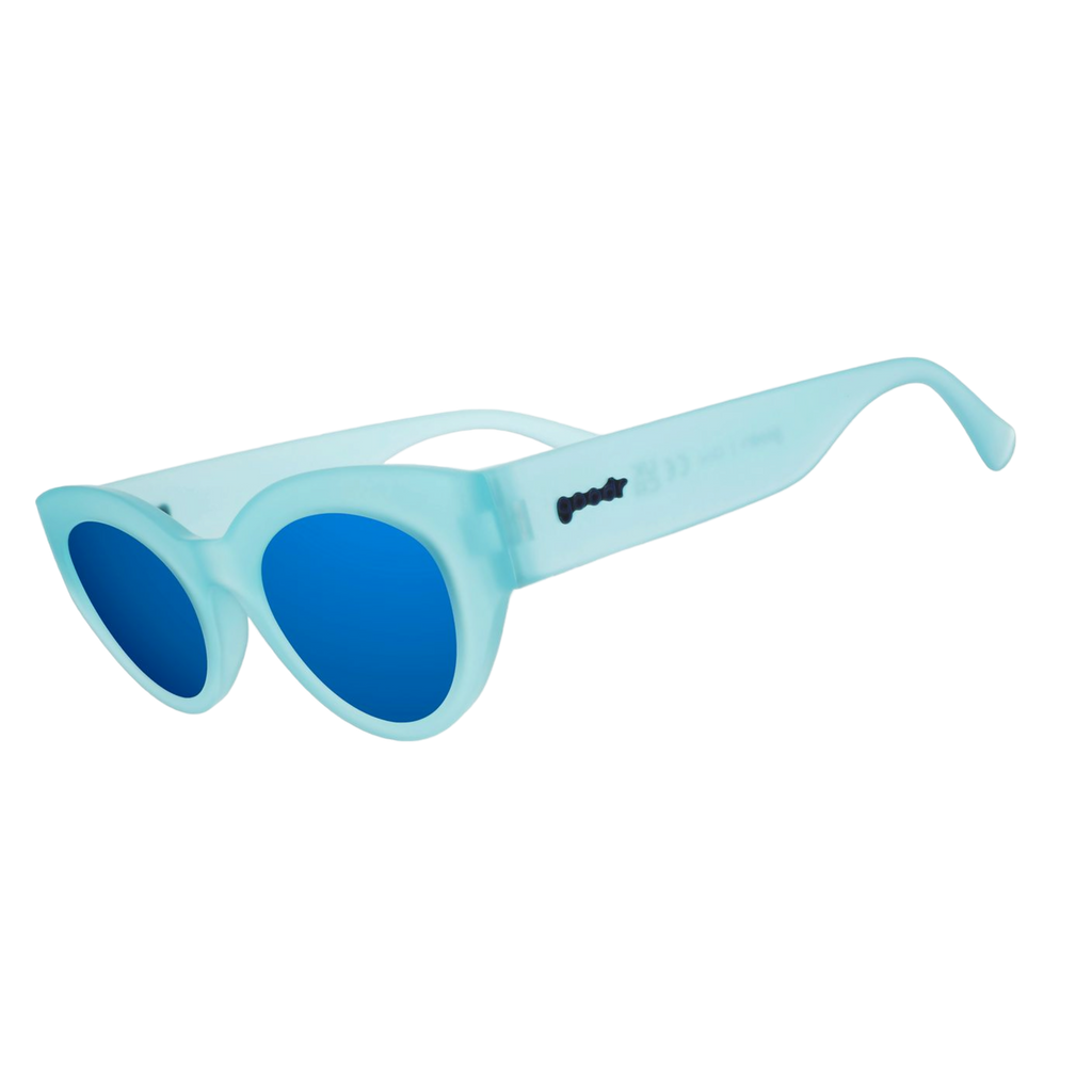 Three-quarter angle view of translucent light blue Moon G sunglasses with blue reflective lenses.
