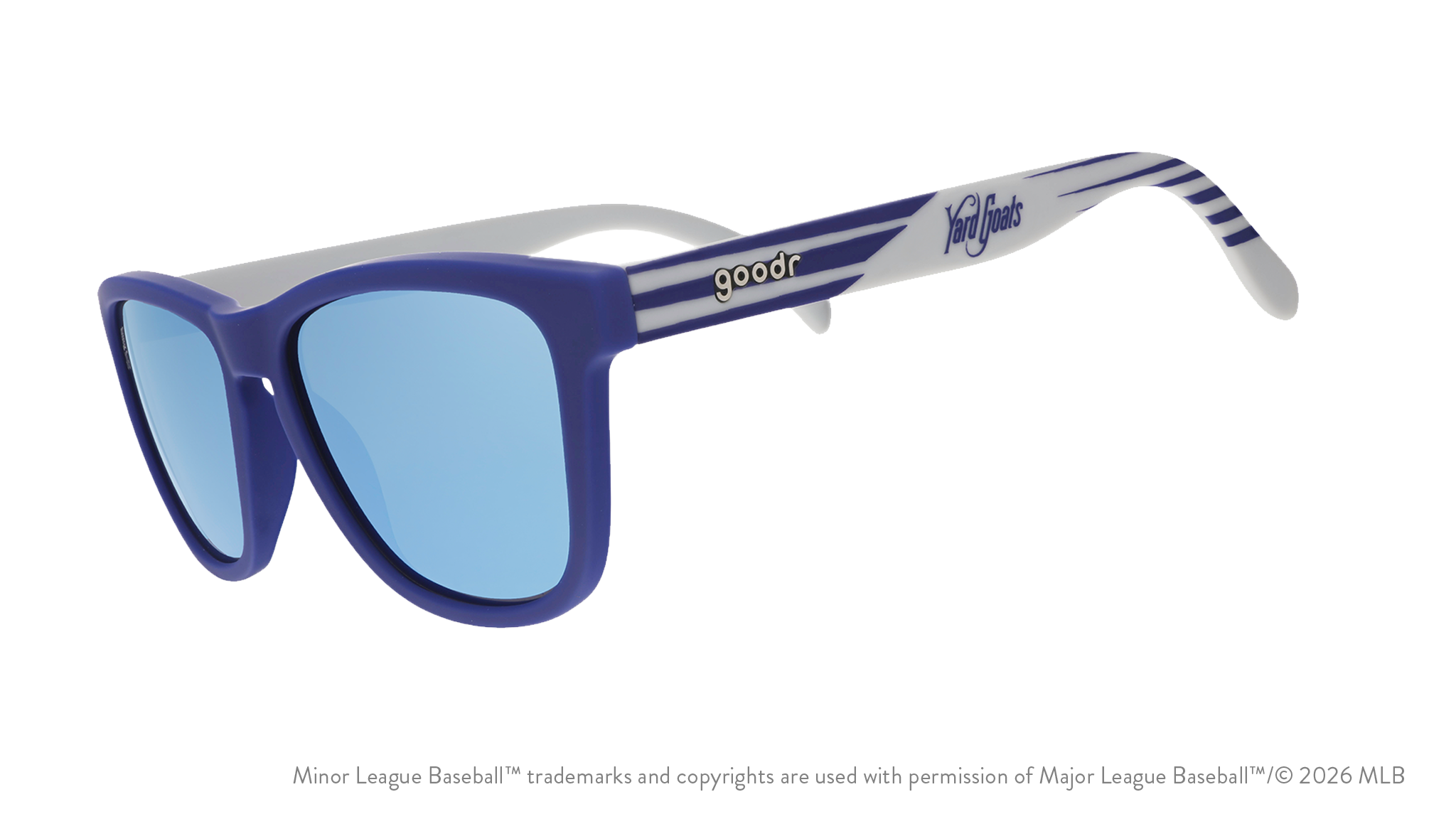 Three-quarter angle view of shades tilted down. Blue + gray frames w/ Yard Goats on temples. Teal reflective lenses.