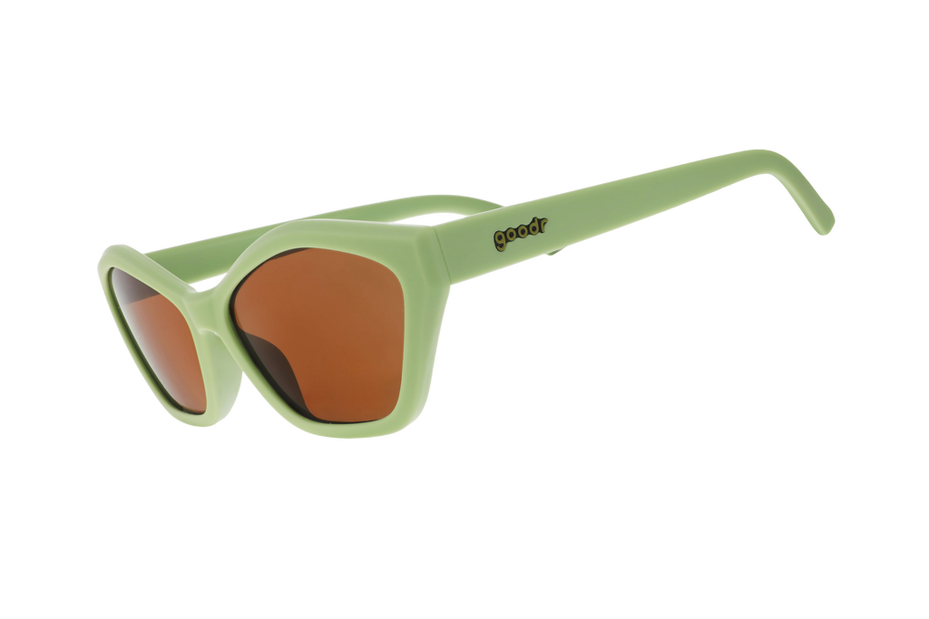 Front view of green cat-eye sunglasses featuring a geometric frame and brown lenses.
