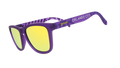 Angled view of shades tilted down. Purple frames w/ stripes + Orlando City on temples. Violet reflective lenses.