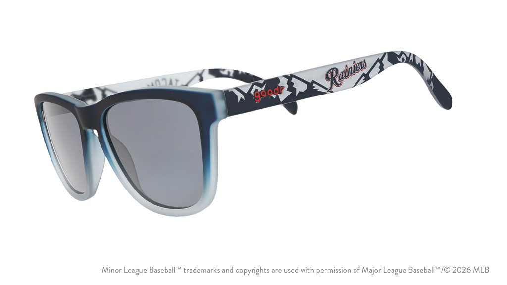 Three-quarter angle view of shades. Gray frames w/ mountain pattern, Rainiers on temples + black non-reflective lenses.