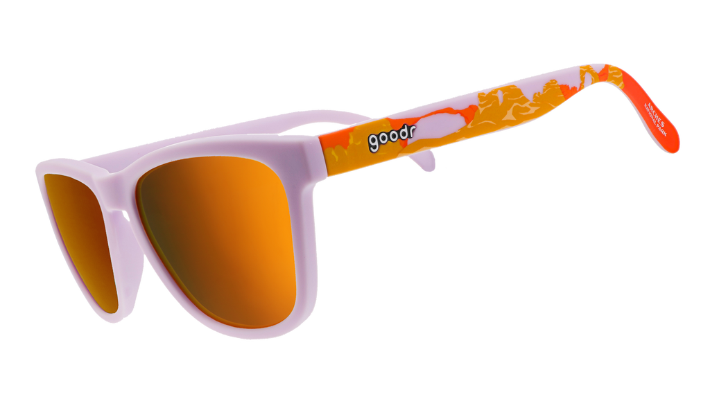 Sunglasses with light purple frames, reflective orange lenses, and colorful orange-and-red themed arms.