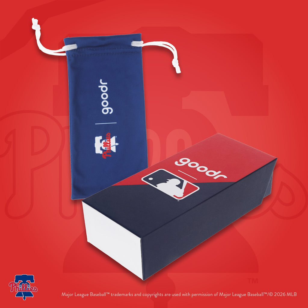 Photograph of custom packaging, featuring a blue microfiber bag with the Phillies' Liberty Bell logo and MLB-themed box.