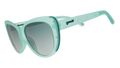 Three-quarter angle view of translucent pale green Glam G cat-eye sunglasses with  green gradient lenses.
