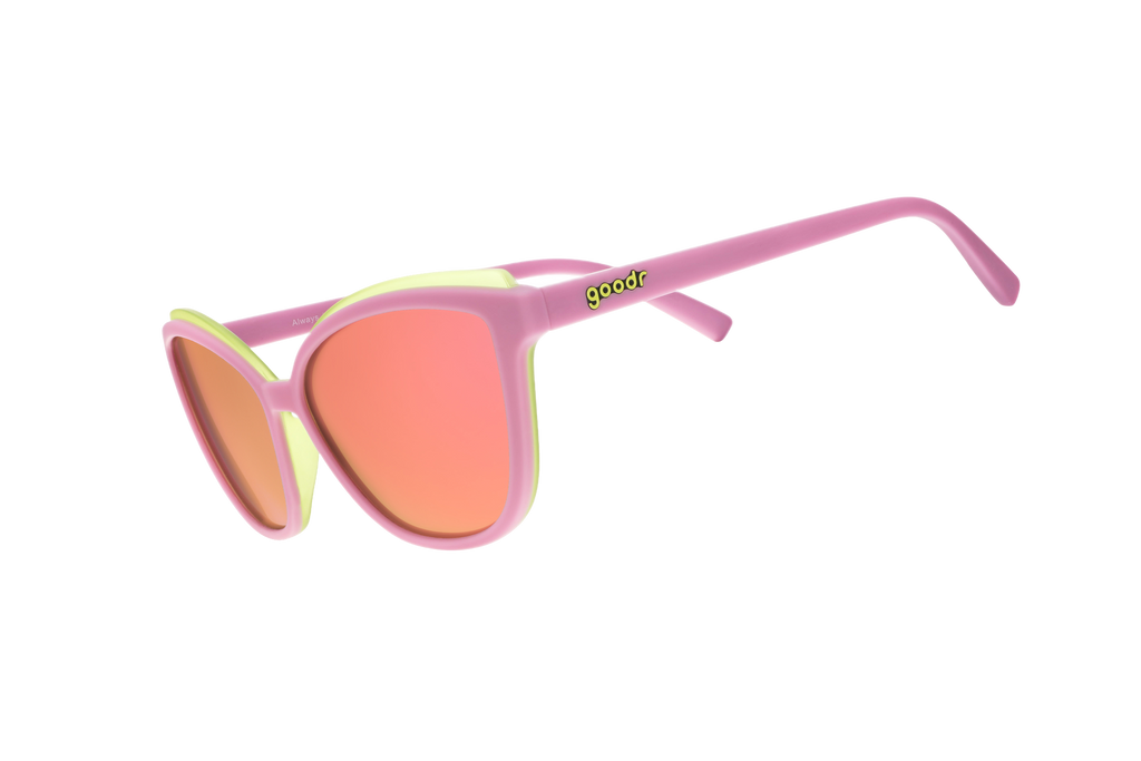 Sunglasses with pink frame and orange lenses on a white background