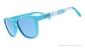Three-quarter angle view of blue sunglasses w/ white Crayola marker pattern + blue reflective lenses tilted down.
