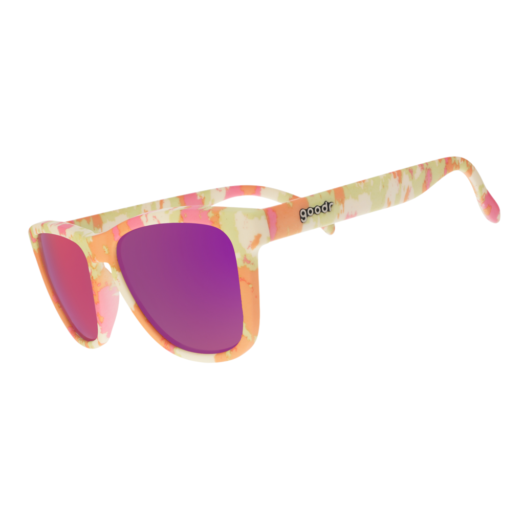 Three-quarter angle view of cheery yellow and pink tie-dye sunglasses in a classic frame shape with pink reflective lenses.