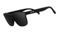 Three-quarter angle view of futuristic-looking black sunglasses with a non-reflective black flat single lens.