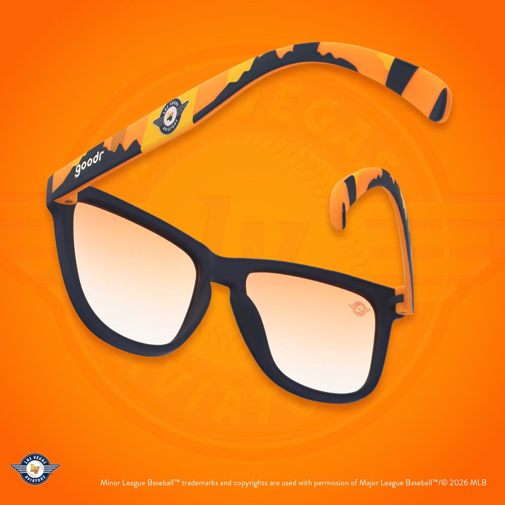 Back view of sunglasses. Blue frames w/ an orange+yellow landscape, Aviators logo + orange gold gradient lenses.