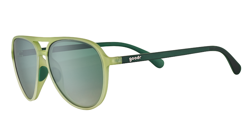 Three-quarter angle view of cadet green translucent aviator sunglasses with gradient green lenses and dark green arms.