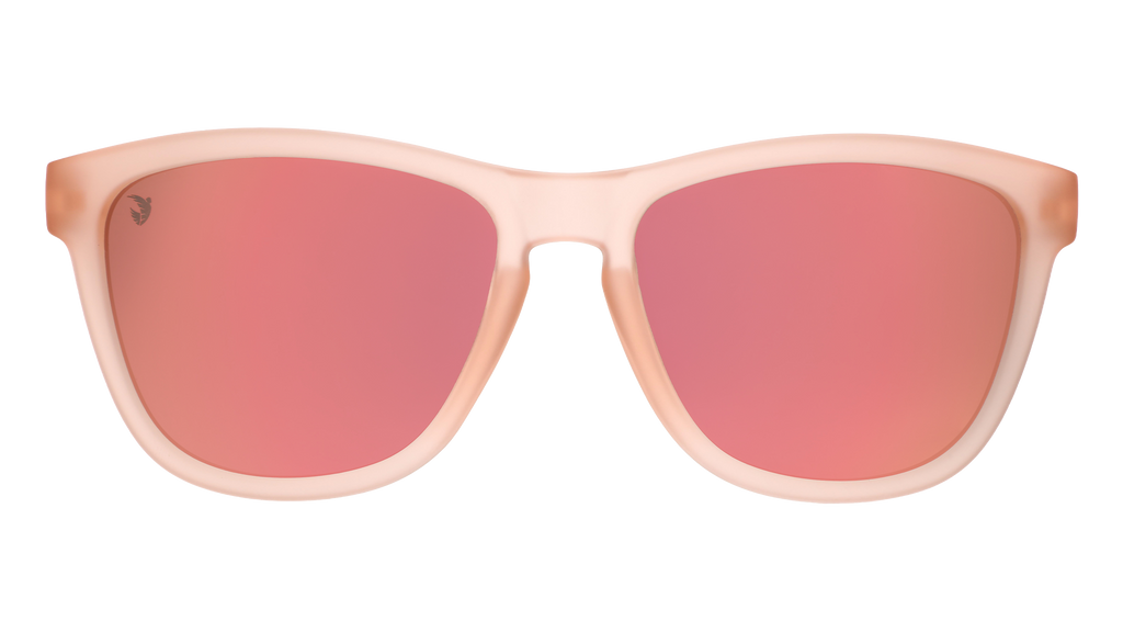 Front view of translucent pink sol rosa sunglasses with reflective champagne gold lenses & ACFC logo.