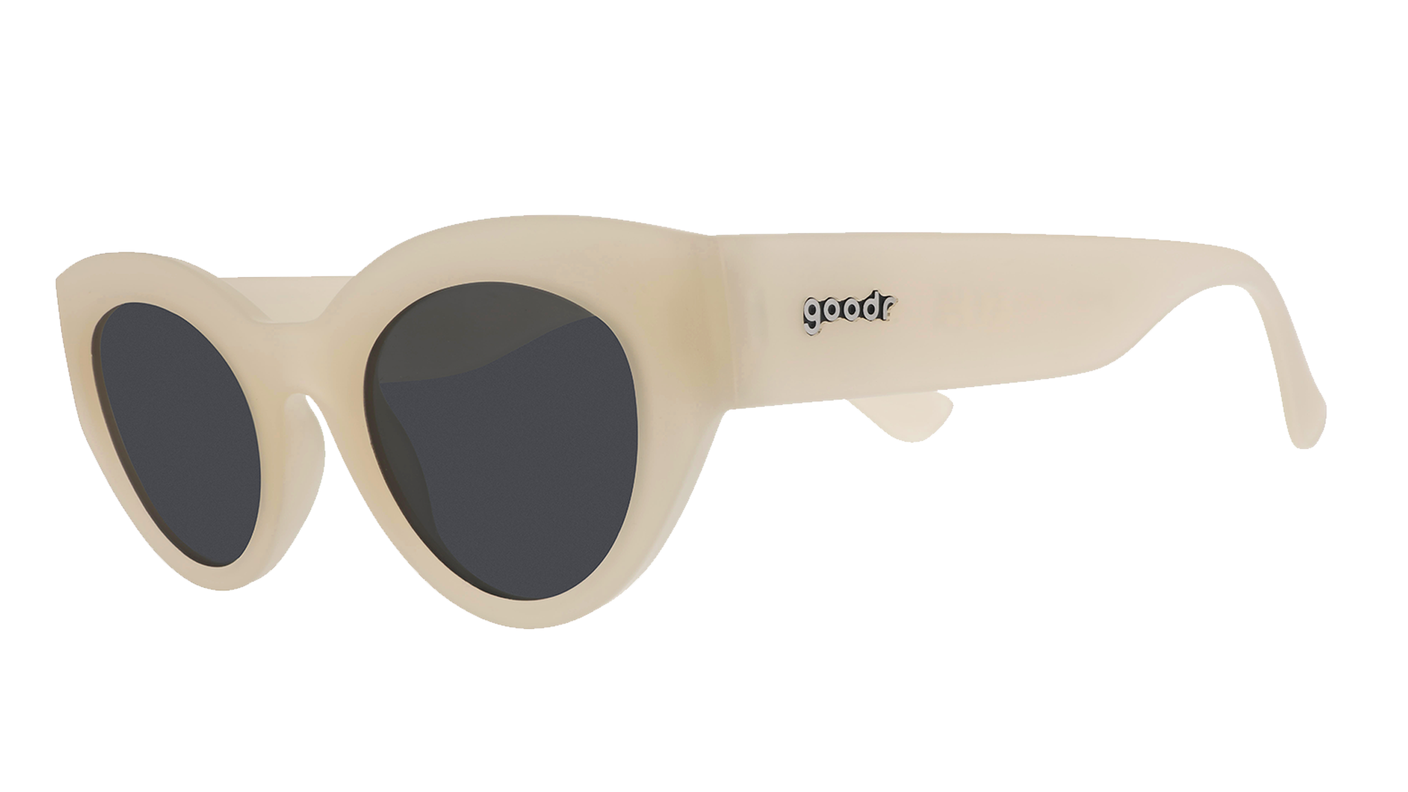 Three-quarter angle view of translucent soft cream, retro-inspired angled cat-eye sunglasses with black non-reflective lenses.