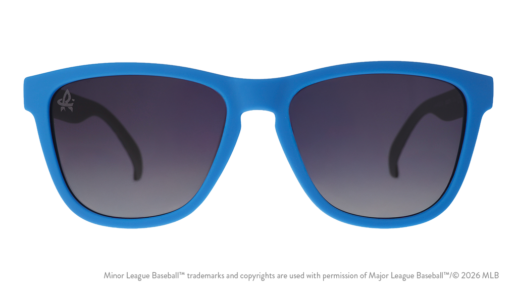 Front view of sunglasses. Blue front frame. Black gradient lenses. Trash Pandas logo etching in top corner of lens.