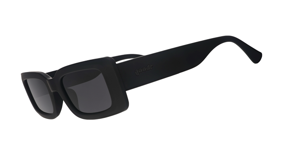 Three-quarter angle view of black rectangular sunglasses with black polarized lenses against a white background.