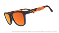 Three-quarter angle view of a pair of black and orange sunglasses featuring the Orioles script logo on the arm.
