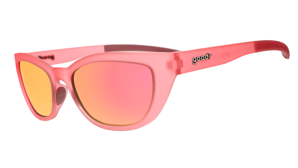 Three-quarter angle view of a pair of translucent pink cat-eye Cheetah G frames with pink champagne reflective lenses.