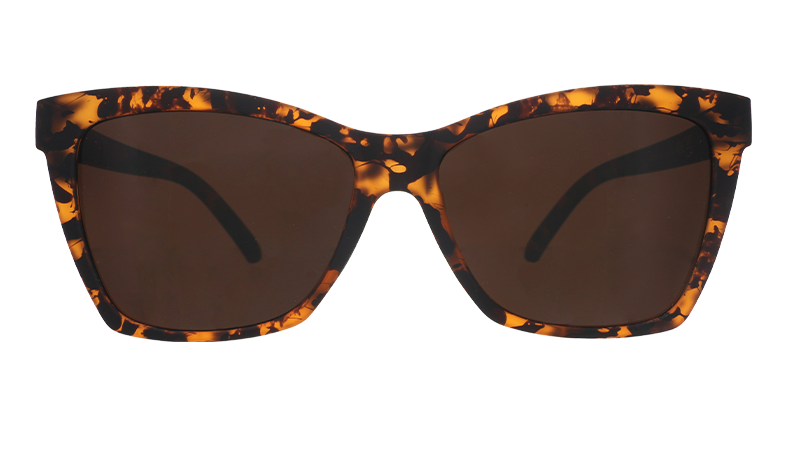 Front view of brown tortoiseshell angled cat-eye sunglasses with non-reflective brown lenses.