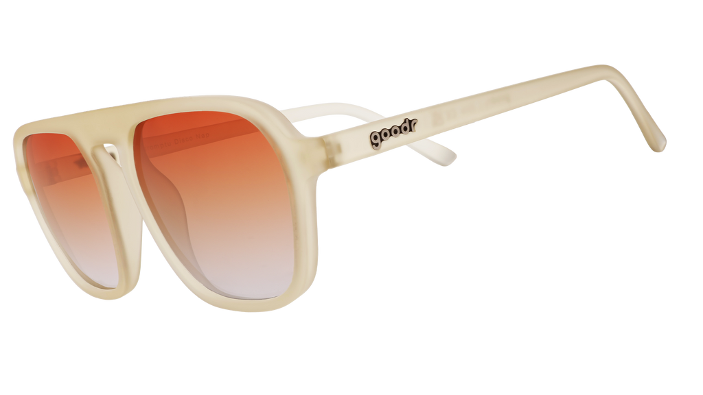 Sunglasses with translucent tan frames and gradient amber lenses.
