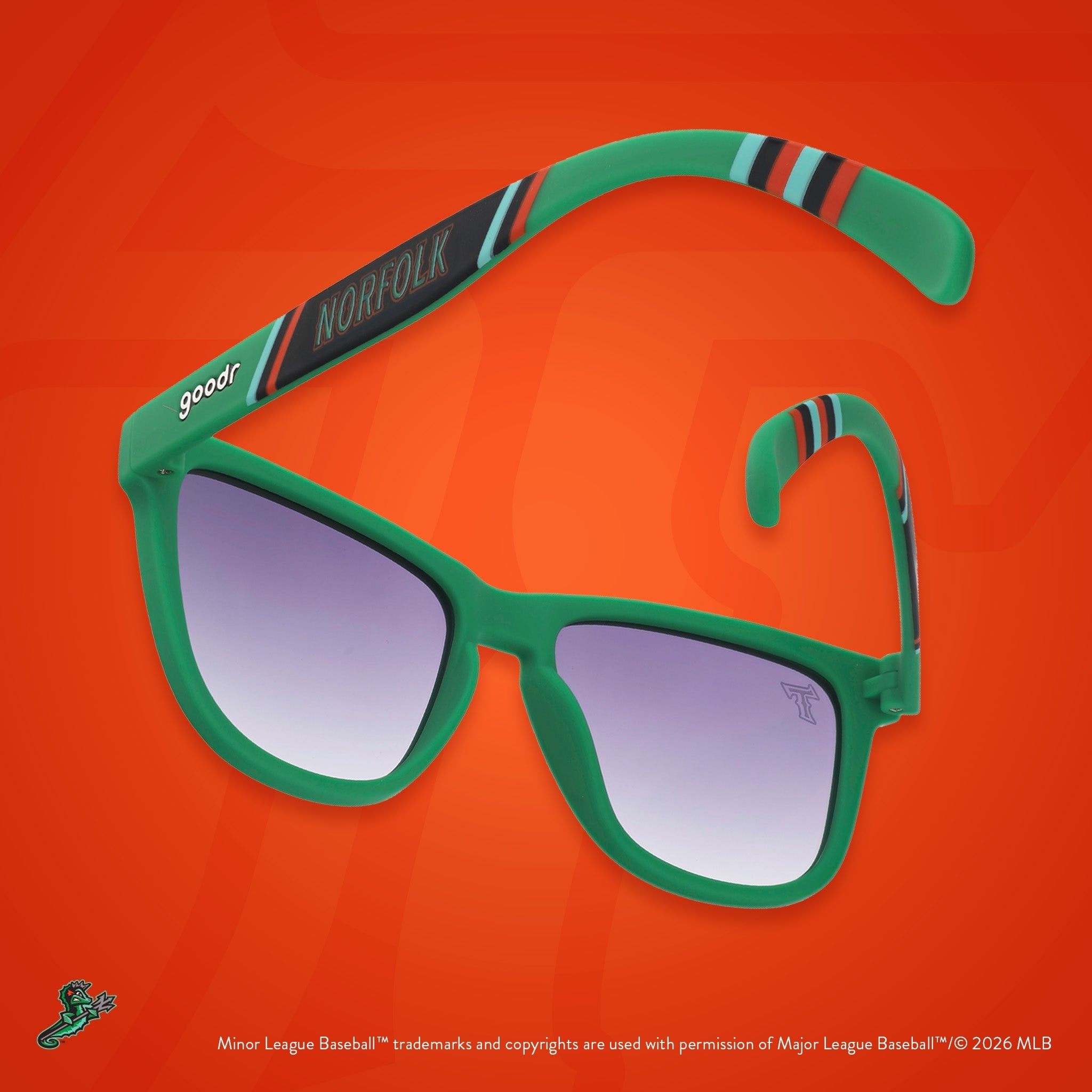 Back view of sunglasses. Green frames w/ a stripe pattern + Norfolk on temples. Black gradient lenses.