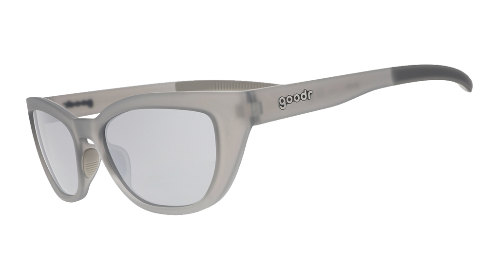 Three-quarter angle view of gray cat eye shades with chrome lenses tilted down on a white background.