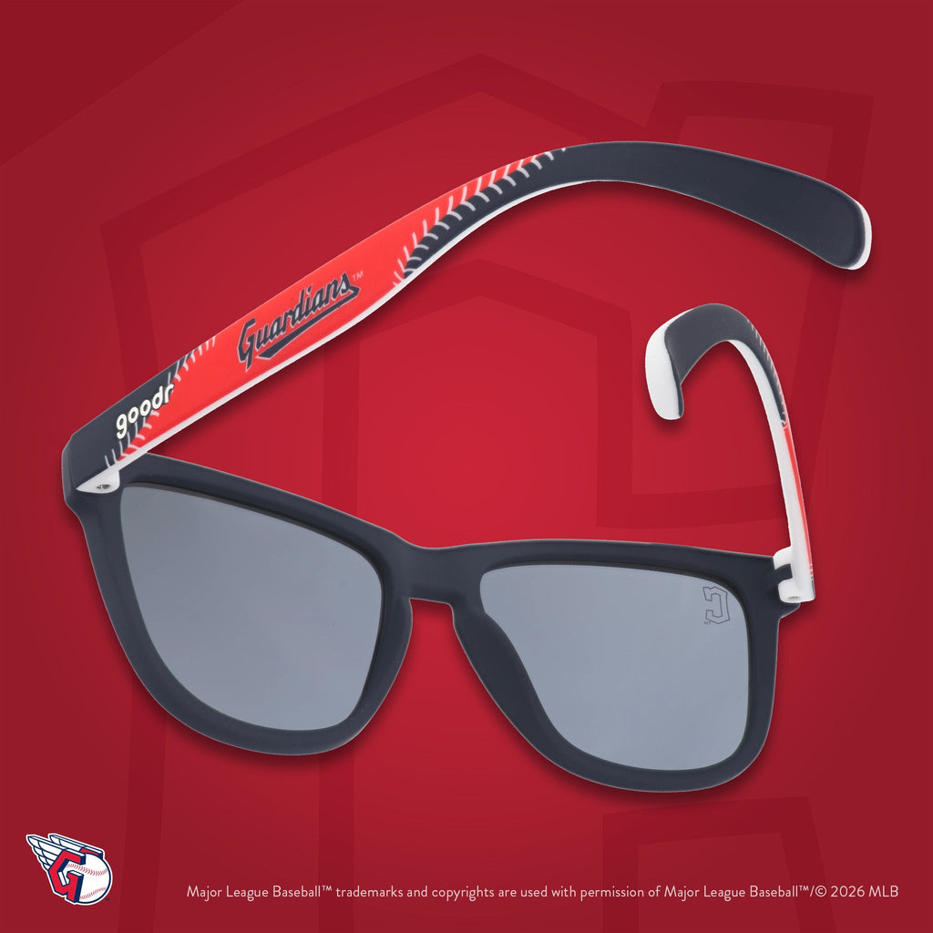 Navy, red, and white Guardians shades photographed from behind, floating against a red background featuring the C logo.