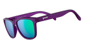 Three-quarter angle view of square-shaped sunglasses with purple frames and reflective green polarized lenses.