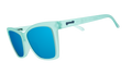 Three-quarter angle view of translucent teal angular sunglasses with reflective teal lenses.