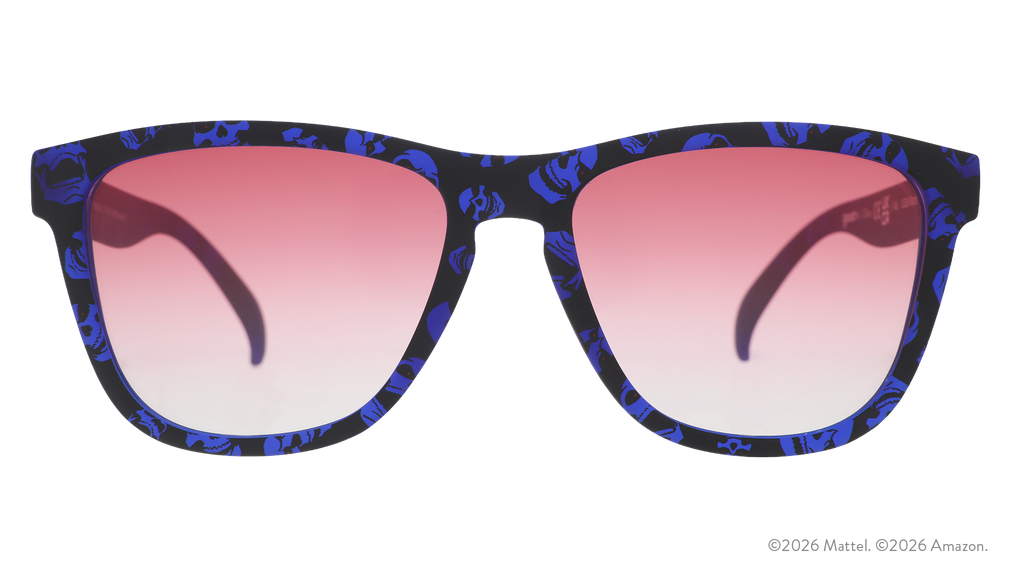 Front view of blue and black sunglasses featuring a Skeletor pattern and rose gradient lenses.