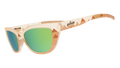 Side view of light brown sunglasses with pyramid-inspired geometric patterns and green lenses.