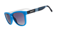 Three-quarter angle view of MLS Charlotte FC shades tilted down. Blue+black frames. Black gradient lenses.
