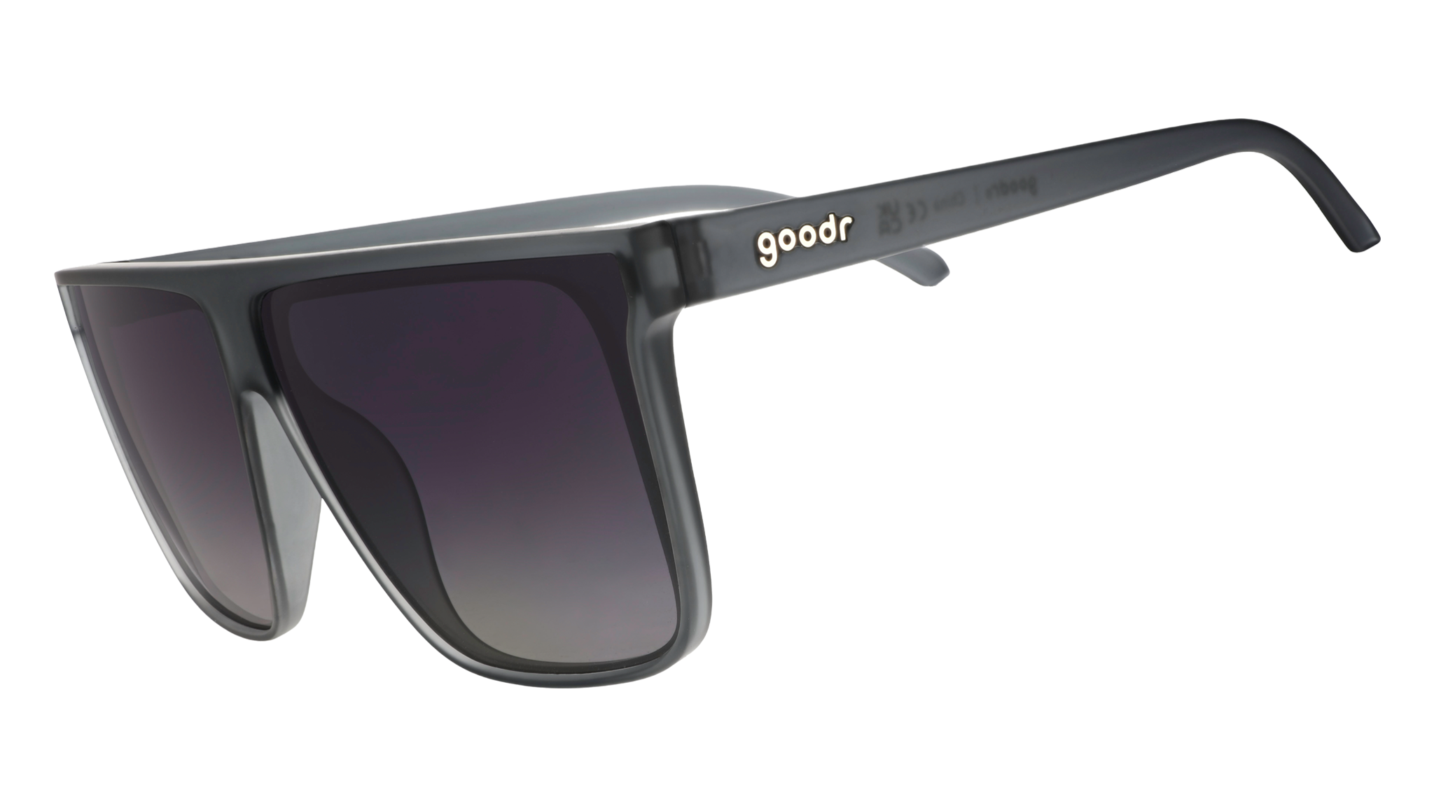 Three-quarter angle view of translucent gray, flat-top Fly G sunglasses with gray gradient lenses.