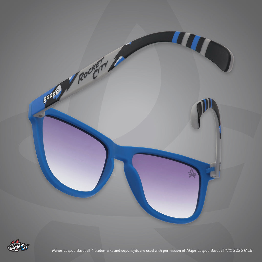 Back view of sunglasses. Blue frames w/ Rocket City on temples + black gradient lenses.