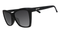 Three-quarter angle view of black angled cat-eye sunglasses with non-reflective black gradient lenses.