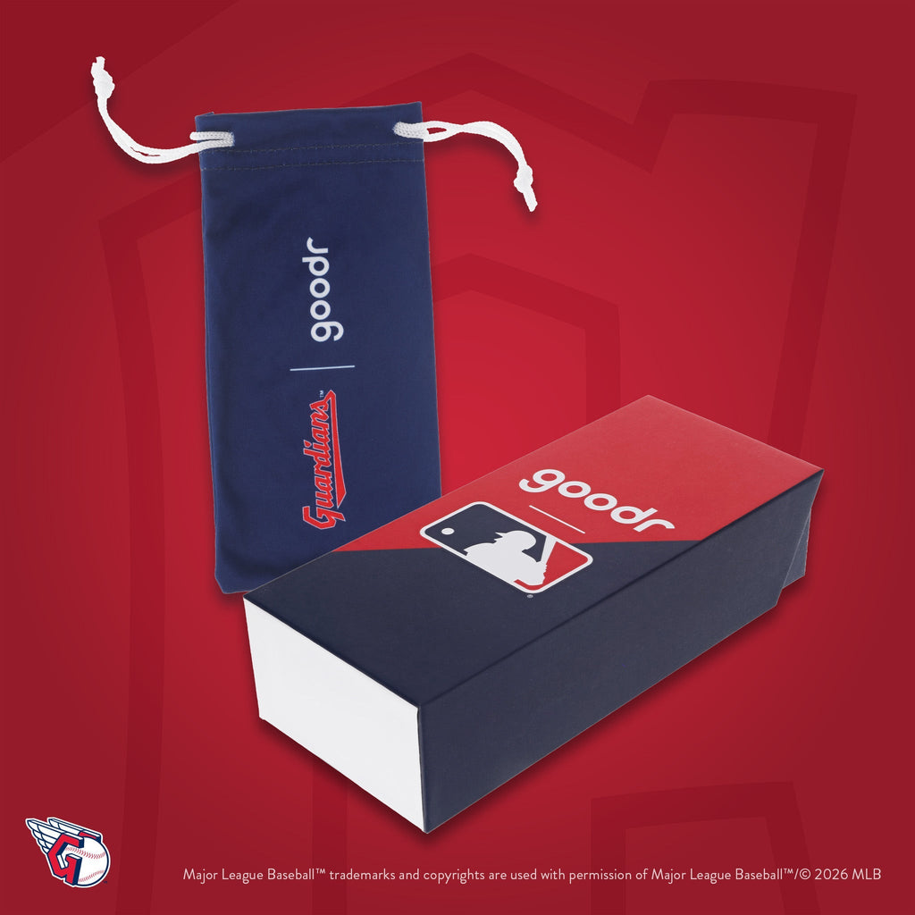 Photograph of custom packaging, featuring a navy microfiber bag with Guardians script logo and MLB-themed box.