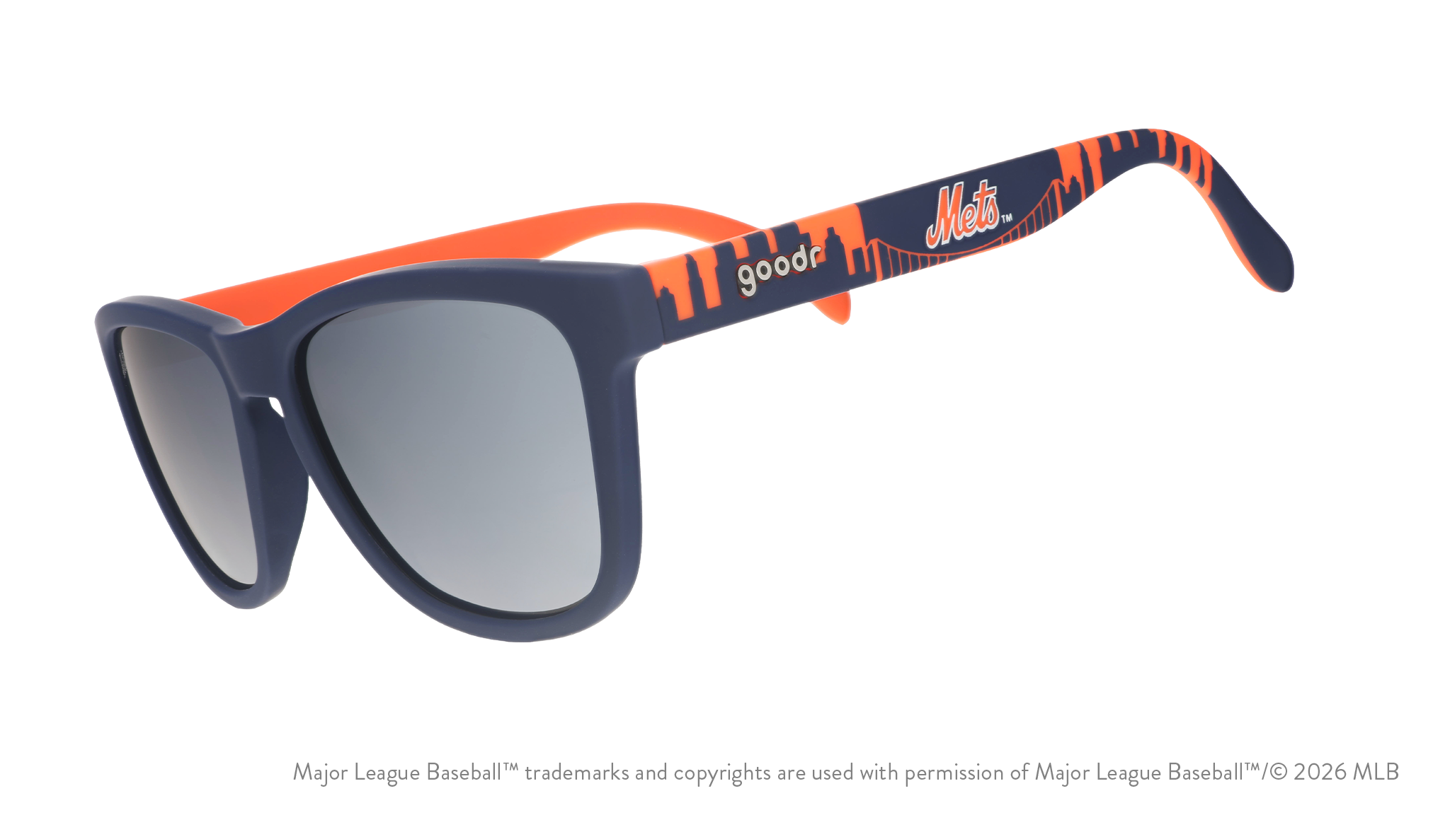Three-quarter angle view of blue and orange Mets sunglasses featuring the script logo and a New York City skyline on the arm.