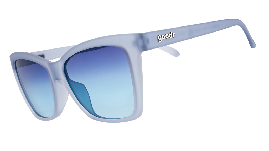 Three-quarter angle view of translucent pale blue Pop Gs with blue gradient lenses.