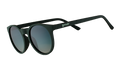 Three-quarter angle view of dark green round sunglasses with circle-shaped green gradient lenses.