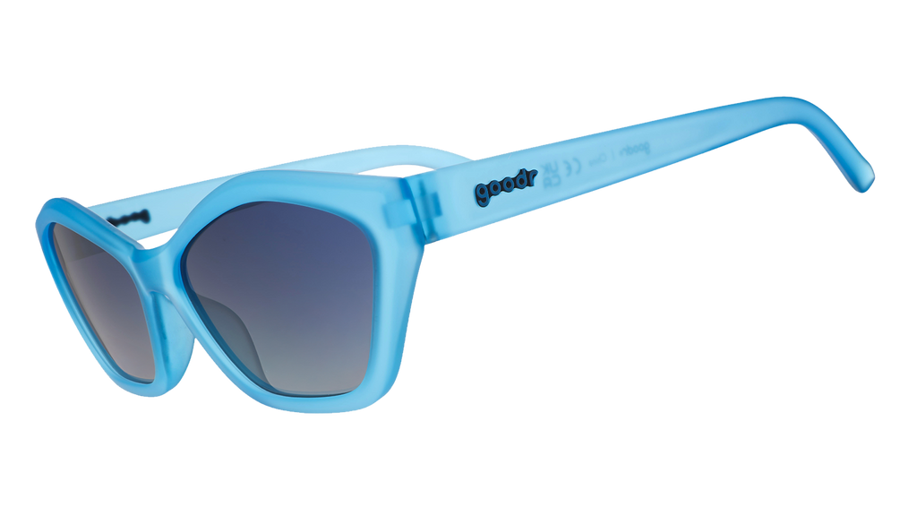 Three-quarter angle view of translucent blue geometric cat-eye Deco G sunnies with blue gradient lenses.