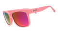 Three-quarter angle view of pink sunglasses with pink-purple lenses designed to float in water.