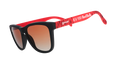 Three-quarter angle view of MLS New York Red Bulls shades tilted down. Red+black frames. Orange+gold gradient lenses.