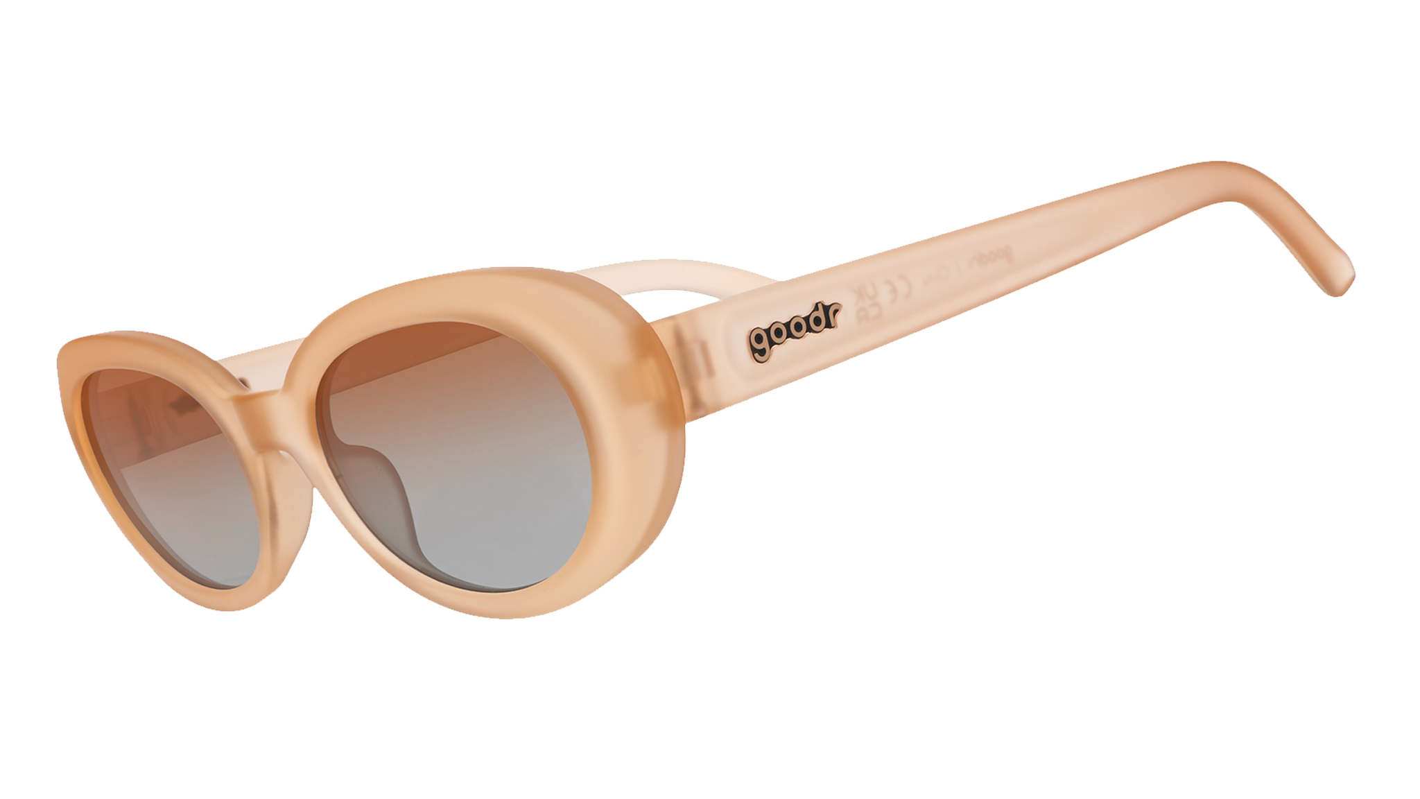 Three-quarter angle view of translucent pale peach oval Beat G sunglasses with orange-gold gradient lenses.