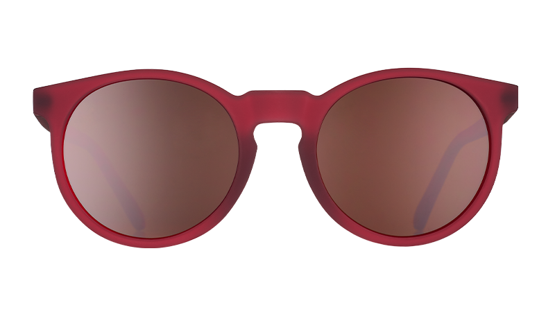 Front view of round burgundy sunglasses with round brown non-reflective lenses.