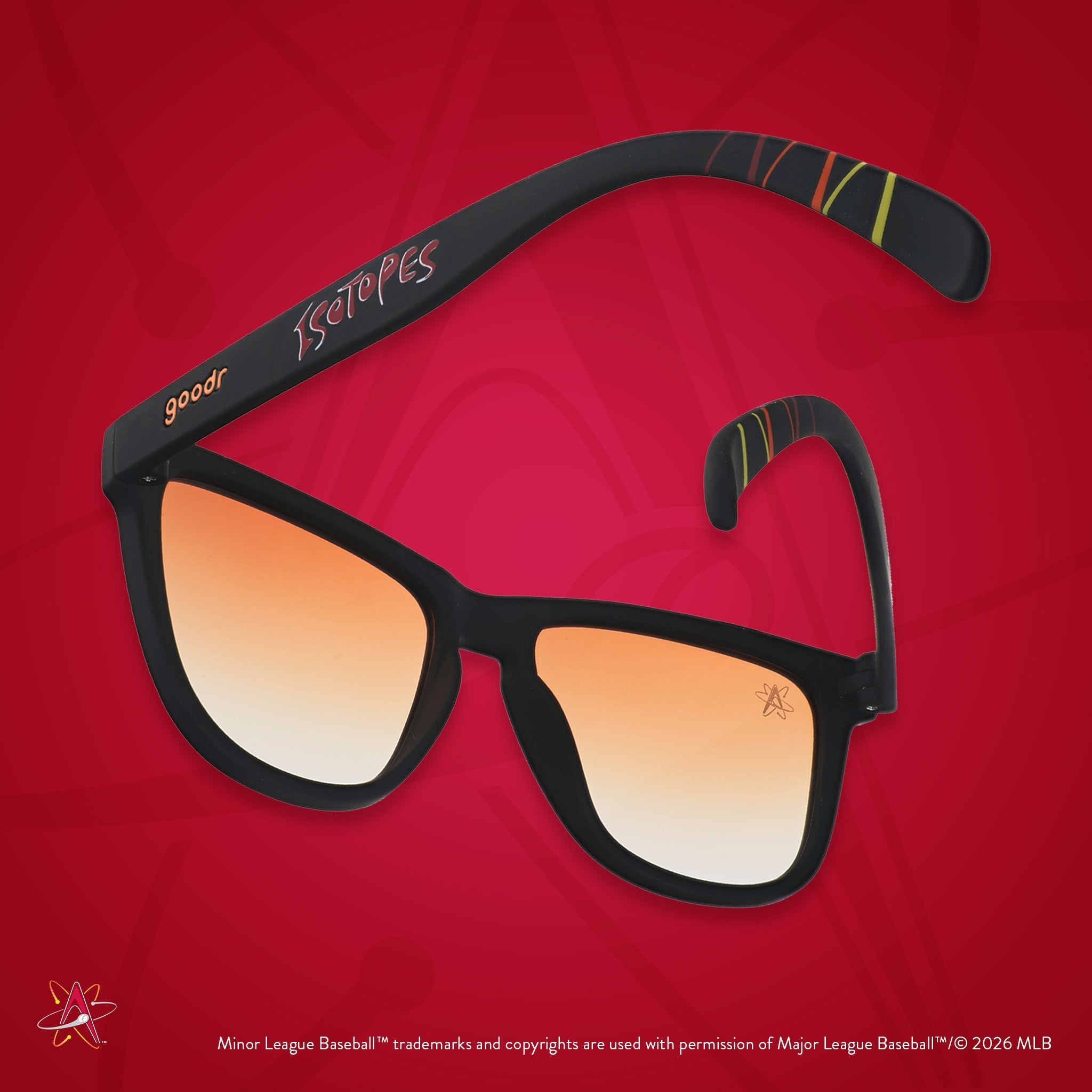 Back view of sunglasses tilted down. Black frames w/ Isotopes + logo on temples. Amber reflective lenses.