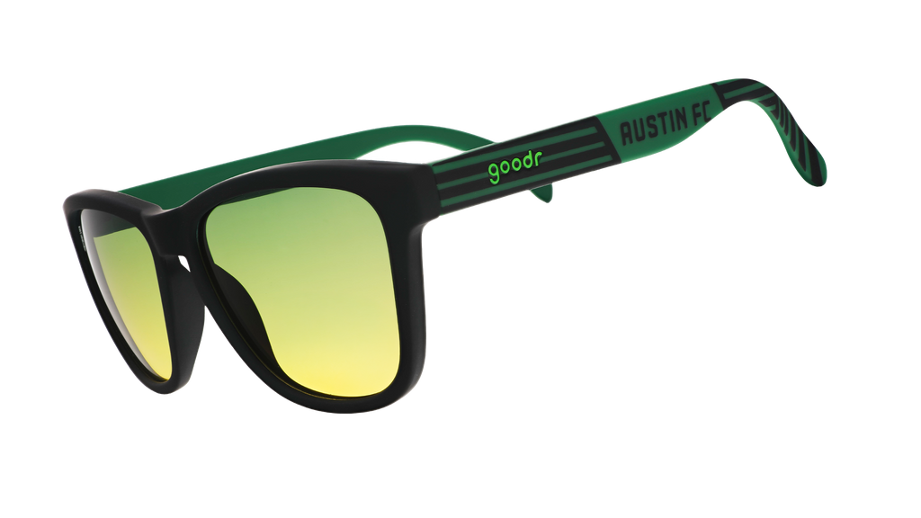 Three-quarter angle view of Austin FC Major League Soccer sunglasses with green and black frames and green-yellow lenses